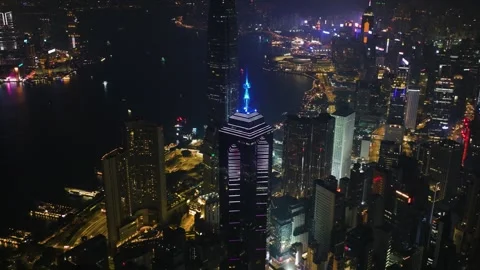 Panoramic drone shot around illuminated skyscrapers of downtown Hong Kong Stock Footage 340281033
