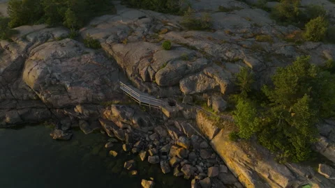 Panoramic drone shot of a giant's kettle geological feature in the Hankoniemi 스톡 동영상 332636004
