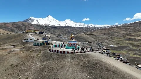 Panoramic Drone Shot of Langza Buddha and Barren Mountain Landscape Stock Footage 329331629