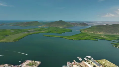 Panoramic drone shot of mountainous greenery in Topolobampo, sunny day in Mexico Video stock 321380312
