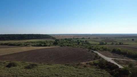 Panoramic Drone Shot Over Summer Farmland. Stunning Drone Aerial of Cultivated Stock Footage 340034133