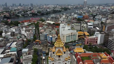 Panoramic drone shot of Wat Traimit temple in Bangkok, Thailand 4K Stock Footage 240293692