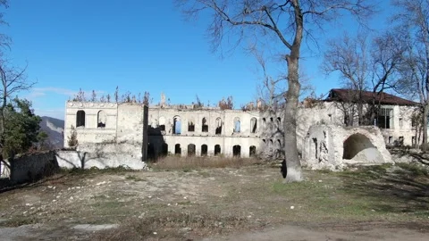 Panoramic Drone view of Abandoned and Destroyed Apartment Building in Shusha Stock Footage 239821687