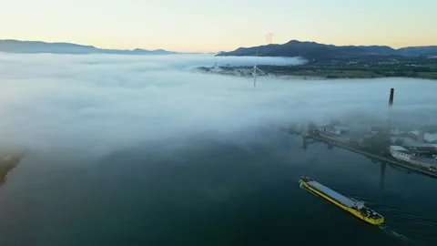 Panoramic drone view of a barge floating in dense fog on the Rhone River Stock Footage 219588505