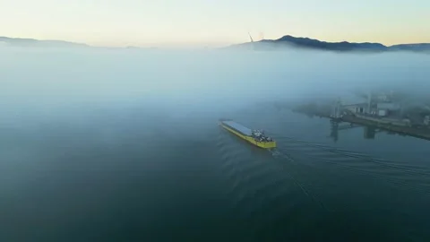 Panoramic drone view of a barge floating in dense fog on the Rhone River Stock Footage 219588531
