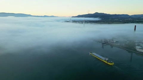 Panoramic drone view of a barge floating in dense fog on the Rhone River Stock Footage 219588543