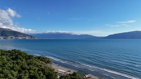 Panoramic drone view of blue sea and mountains under clear sky Stock Footage 332559449