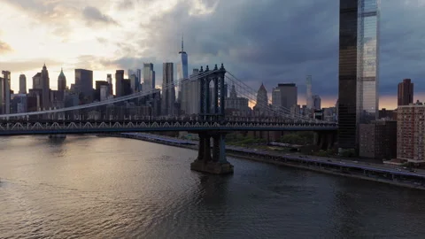 Panoramic drone view of Brooklyn Bridge and Manhattan skyline at sunset. New Stock Footage 345734824