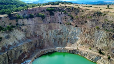 Panoramic drone view of the circular Tsar Asen mine pit in Bulgaria. Stock Footage 311750394