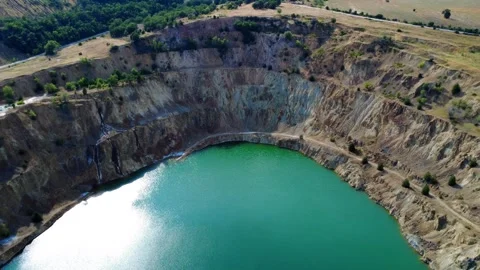 Panoramic drone view of the circular Tsar Asen mine pit in Bulgaria. Stock Footage 311750402