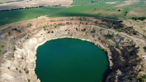 Panoramic drone view of the circular Tsar Asen mine pit in Bulgaria. Stock Footage 311750419