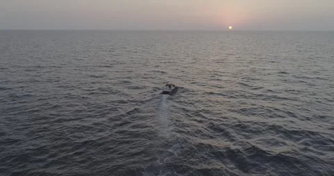 Panoramic Drone View of Couple Sailing in Wooden Boat at Sunset in Sochi, Russia Stock Footage 344008202