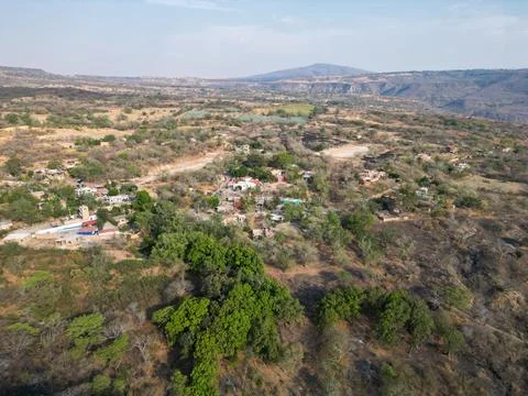 Panoramic drone view of El Chilar village with surrounding dry hills, natural Stock Photos