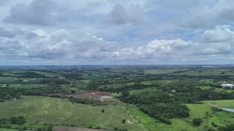 Panoramic Drone View of Green Countryside Under Dramatic Clouds 스톡 동영상 325811622
