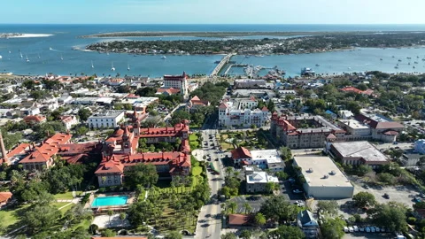 A panoramic drone view highlights the layered cityscape of St. Augustine Stock Footage 327492005
