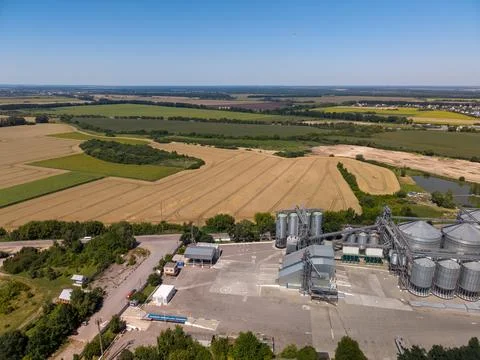 Panoramic Drone View of Industrial Processing Structures and Rural Fields Photos