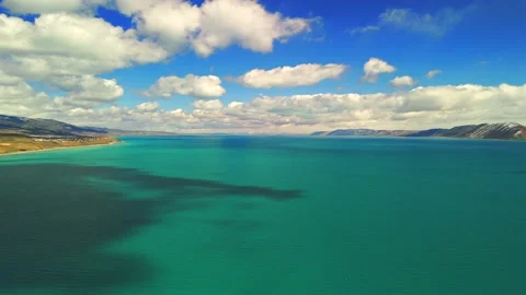 Panoramic drone view over Bear Lake Utah with turquoise water and clouds Stock Footage 335080815