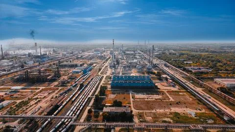 Panoramic drone view of refinery plant with tall cooling towers. Petrochemi.. Stock Photos