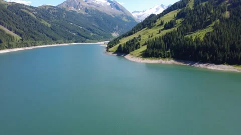 Panoramic Drone View of a Serene Alpine Lake Surrounded by Lush Green Mount.. Stock Footage 333627447