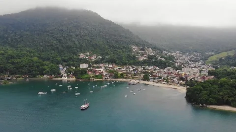 Panoramic Drone View Of A Small Town On The Sea Beach With Green Hills Stock Footage 172434736