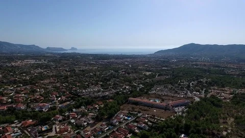 Panoramic drone view of Spanish coastal communities of La Nuccia and Benidorm Stock Footage 73698673