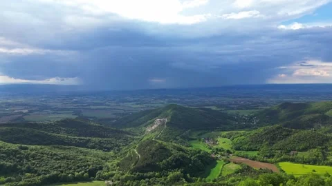 Panoramic drone view of tree-covered hillsides of the heights of the Vercors Stock Footage 242723872