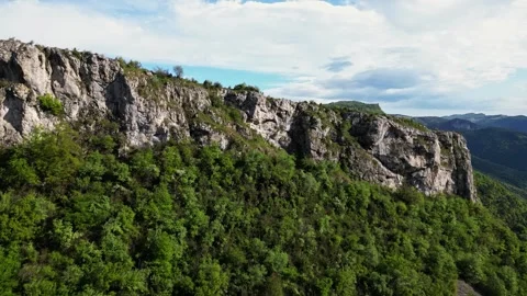Panoramic drone view of tree-covered hillsides of the heights of the Vercors Stock Footage 242724963