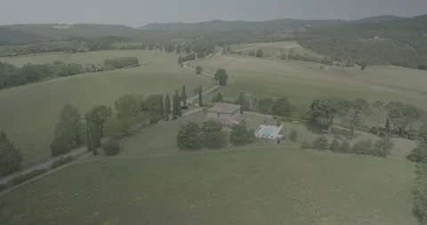 Panoramic Drone View of Tuscan Villa, Road and Cypress Hills in Italy Stock Footage 343932977