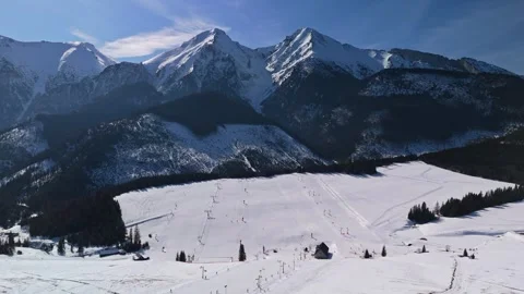 Panoramic drone view of Ždiar ski resort and snowy High Tatras village Stock Footage 346312794