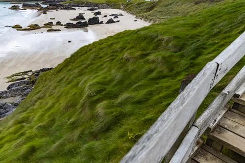 Panoramic Durness Beach, waves, sand and striking rocks along the shore. Stock Photos