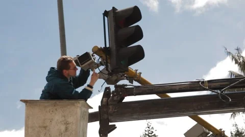 Panoramic of an electrician working on 7th Avenue Stock Footage 42269233