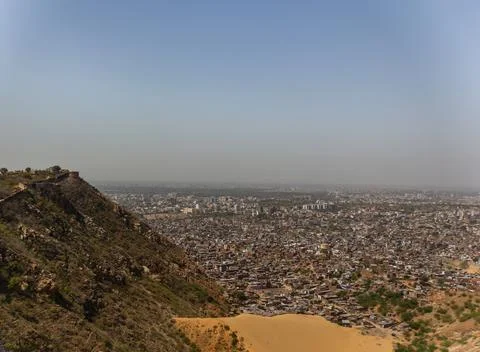 Panoramic Elevated View of a Dense City Sprawl Below an Arid Hill with Fort Wall Stock Photos