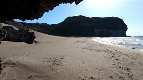 Panoramic of an empty beach from a cave Stock Footage 271243005