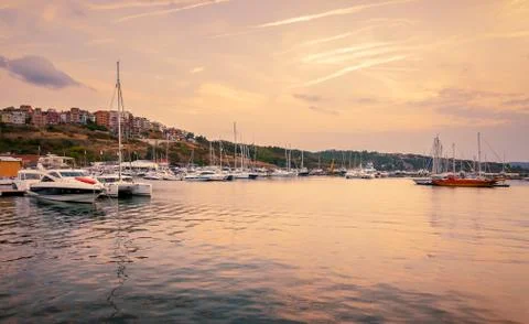 Panoramic evening view of the seaport at sunset Stock Photos