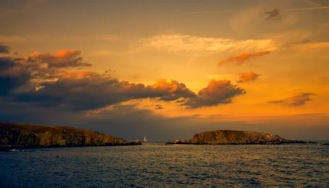 Panoramic evening view of two islands at sunset Stock Photos