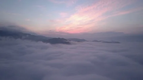 Panoramic flight above clouds in morning Stock Footage 85409523