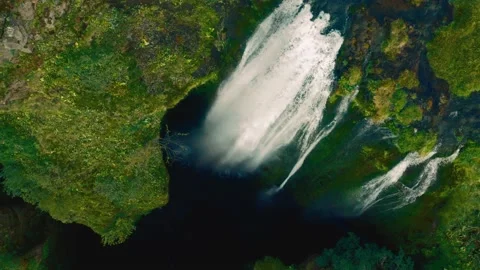 Panoramic flight from the bowels of famous waterfall Gljufrabui in Iceland 動画素材 167082635