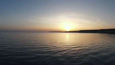 Panoramic flight at sunset over Kourion beach with a little haze, Cyprus Stock Footage 152519855