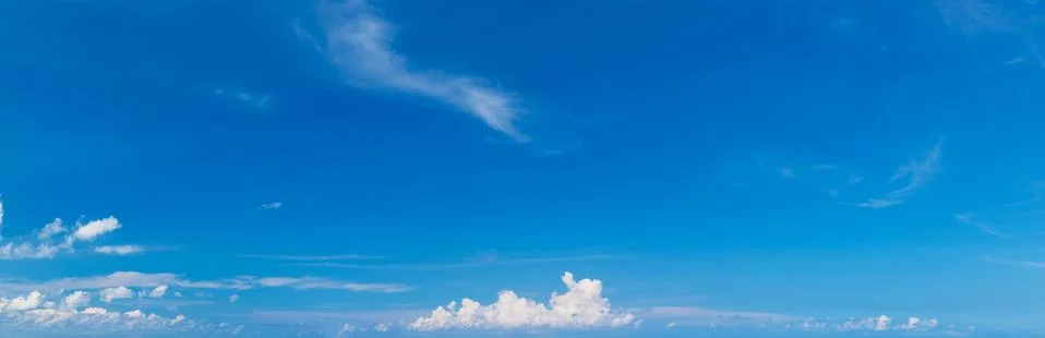 Panoramic fluffy cloud in the blue sky Stock Photos