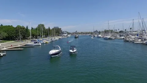 Panoramic fly over Long Beach marina and harbor with speed boats and yachts Stock Footage 73709073