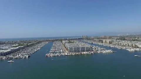 Panoramic fly over Long Beach marina and harbor with speed boats and yachts Stock Footage 73709914