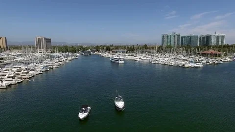 Panoramic fly over Long Beach marina and harbor with speed boats and yachts Stock Footage 73710381