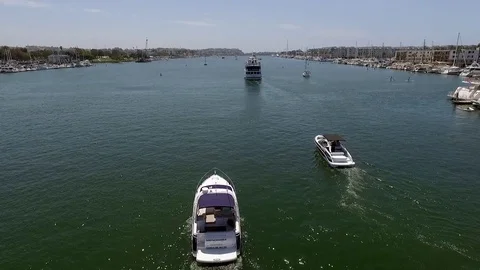 Panoramic fly over Long Beach marina and harbor with speed boats and yachts Stock Footage 73710682