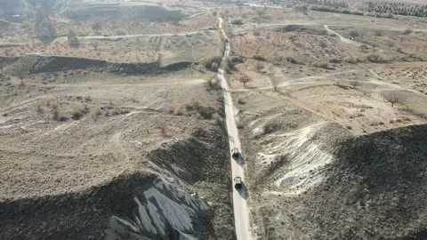 Panoramic Follow Up 4K Drone View of SUV on Dirt Landscape in Cappadocia Turkey Stock Footage 169460630