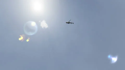 Panoramic helicopter flight in the clear sky straight to the sun. 4K video clip Stock Footage 163745742