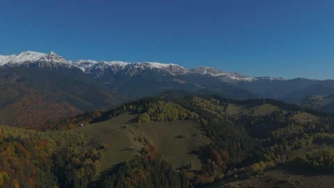 Panoramic High Altitude Hover over Autumn Hills and Snowy Bucegi Mountains .. Stock-Footage 327536910