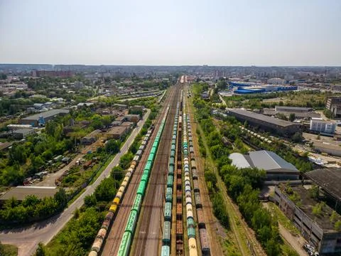 Panoramic high angle drone view of industrial railway station with cargo trai Fotos Stock