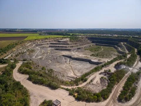 Panoramic high angle drone view of industrial open pit granite quarry and e.. Fotos Stock