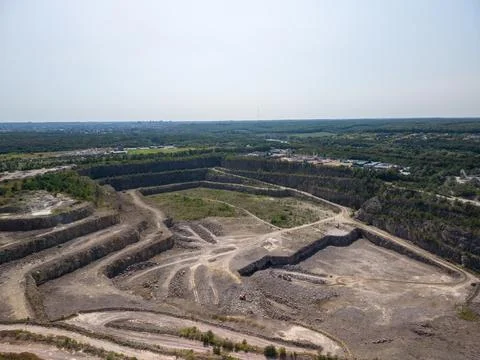 Panoramic high angle view of active open pit granite stone quarry and excav.. Fotos Stock