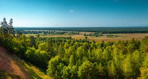 Panoramic high angle view of the plain, the village and the woods from hill t Stock Photos